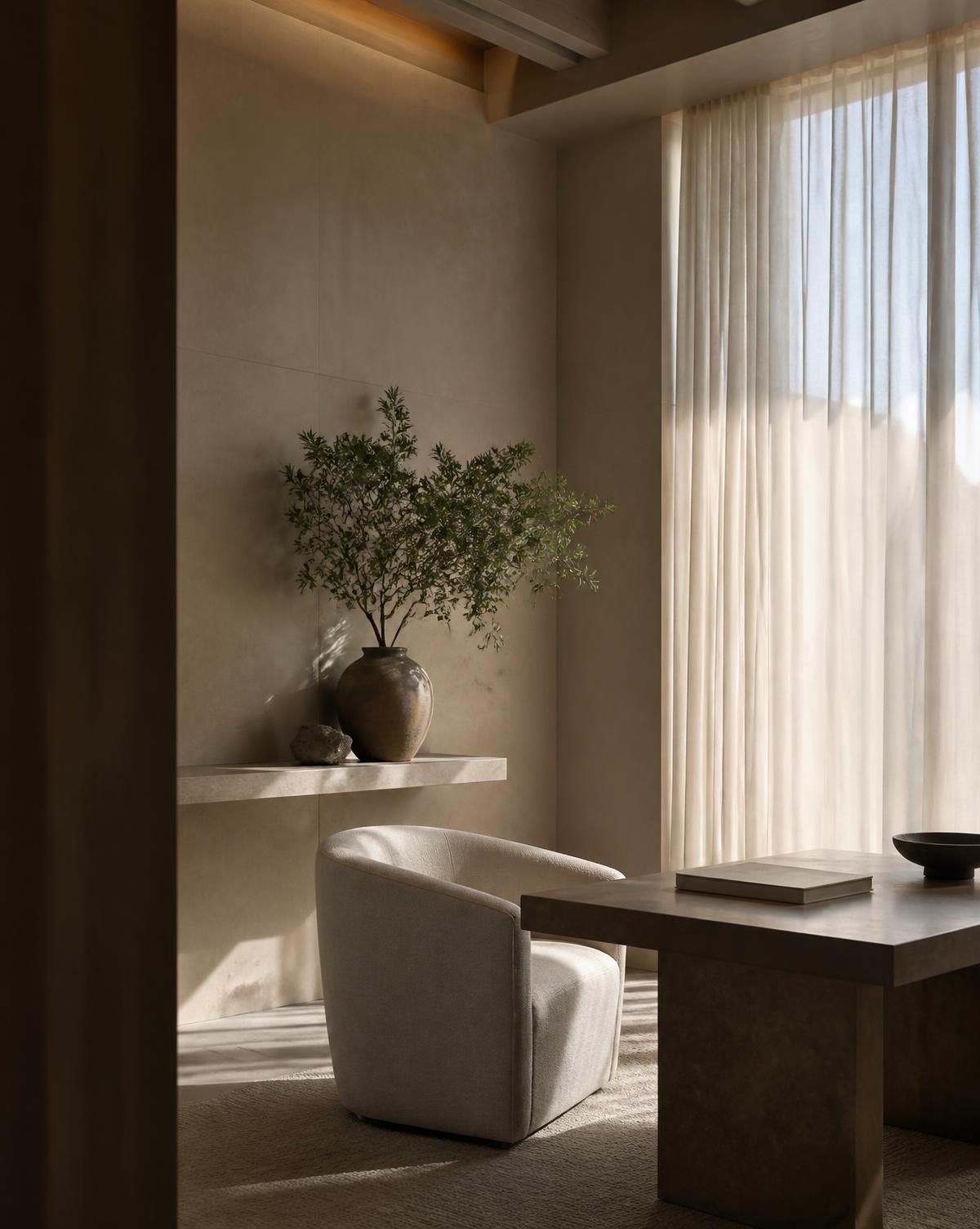 Quiet consultation interior in warm limestone and ivory linen